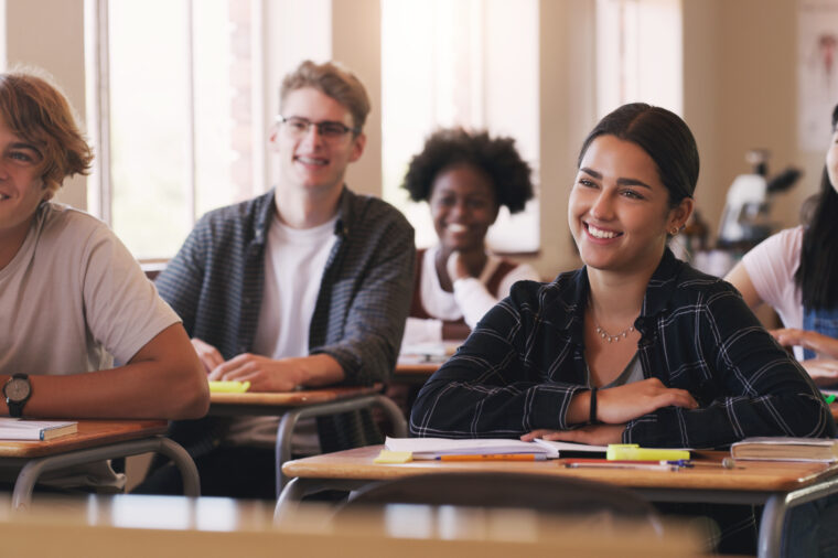 Shot of a group of teenagers in a classroom at high school